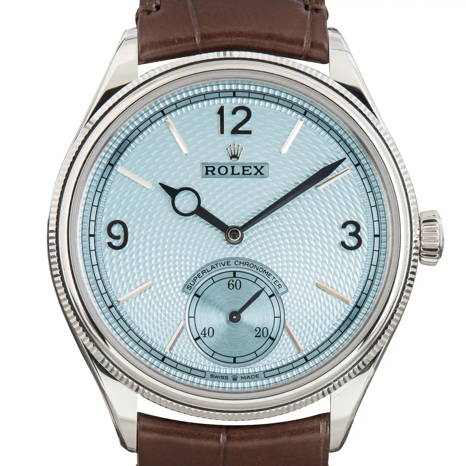 Rolex Perpetual 1908 52506 with an ice blue guilloché dial with small seconds and a fluted platinum bezel, a pre-owned example, studio close-up of the case