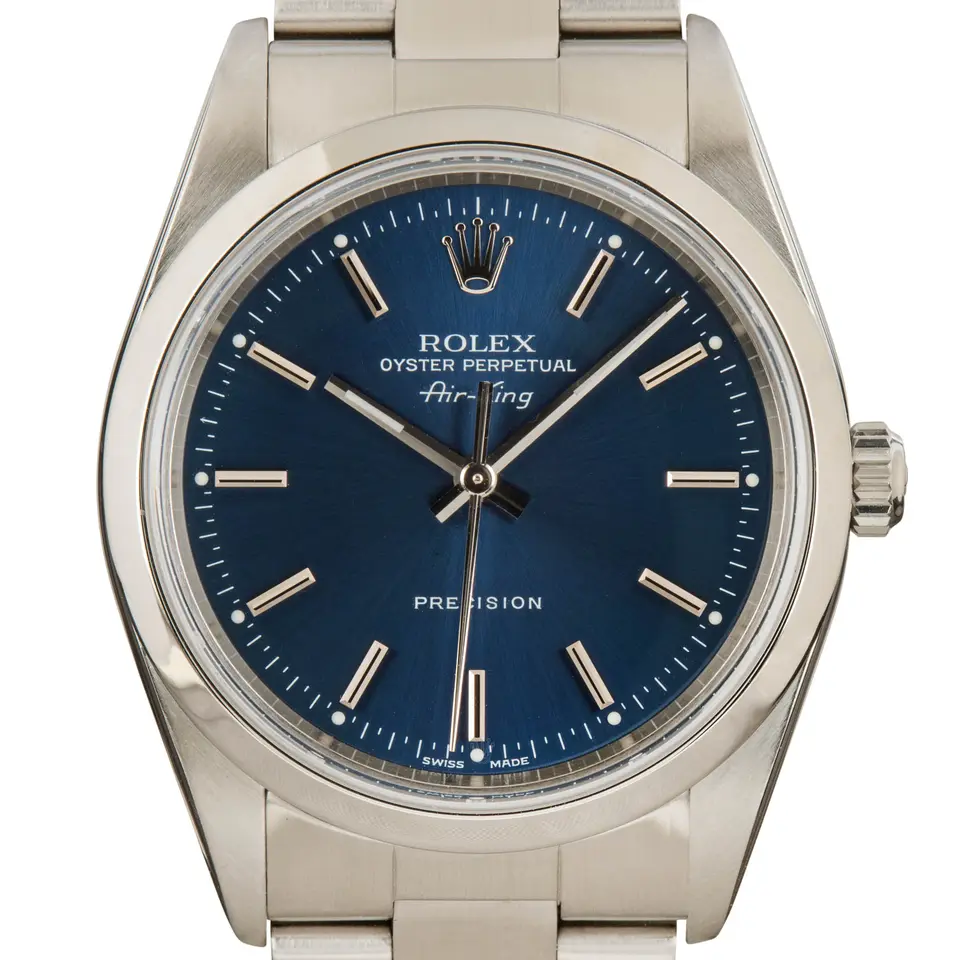 Rolex Air-King 14000M with a blue dial and smooth steel bezel on an Oyster bracelet, a pre-owned example, studio close-up of the case