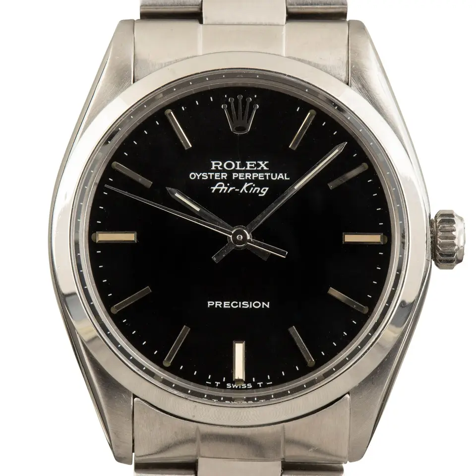 Rolex Air-King 5500 with a black dial and steel bezel on an Oyster bracelet, a pre-owned example, studio close-up of the case
