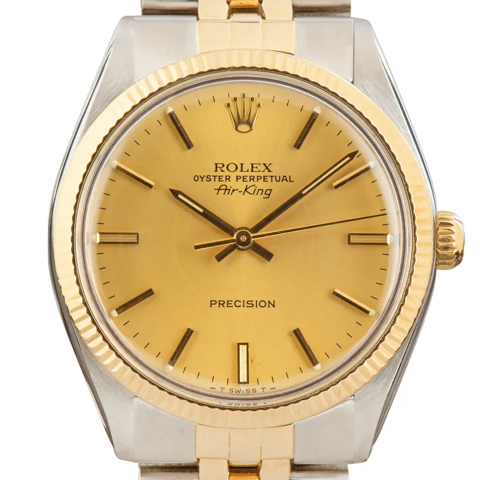 Rolex Air-King 5501 with a champagne Air-King Precision dial, fluted yellow gold bezel and steel and gold Jubilee bracelet, a pre-owned example, studio close-up of the case