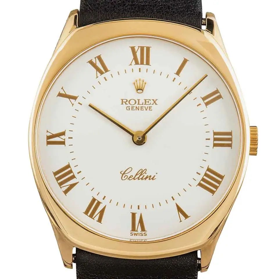 Rolex Cellini 4133 with a white Roman-numeral dial, yellow gold cushion case on a black leather strap, a pre-owned example, studio close-up of the case