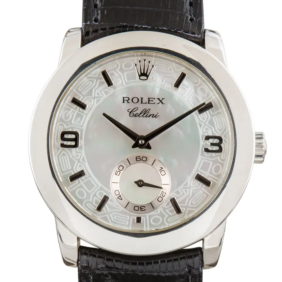 Rolex Cellini 5240 with a mother-of-pearl dial with small seconds, round platinum case on a black leather strap, a pre-owned example, studio close-up of the case