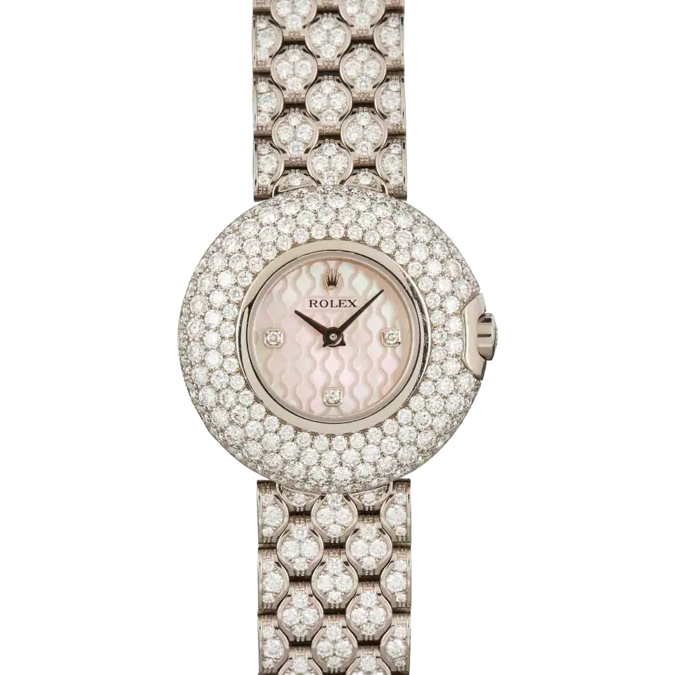 Rolex Cellini 6221 with a pink mother-of-pearl dial, pavé diamond-set round case and diamond-set white gold bracelet, a pre-owned example, front view of the whole watch