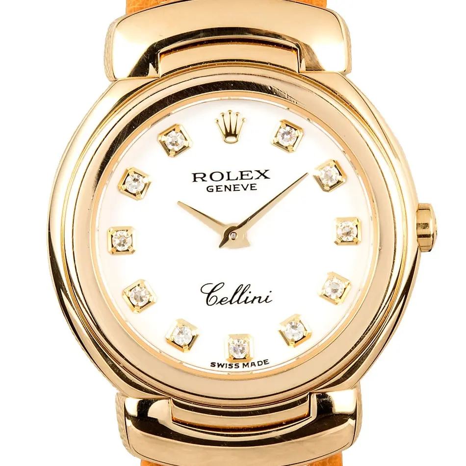 Rolex Cellini 6621 with a white dial with diamond hour markers, yellow gold Cellinium case on a tan leather strap, a pre-owned example, studio close-up of the case