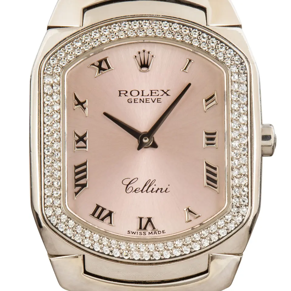 Rolex Cellini 6691 with a pink Roman-numeral dial, diamond-set white gold cushion case and white gold bracelet, a pre-owned example, studio close-up of the case