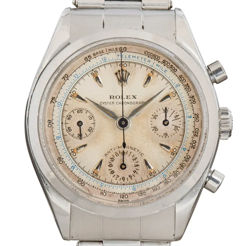 Rolex Chronograph 6234 with a cream chronograph dial with tachymeter scale, steel case and steel Oyster bracelet, a pre-owned example, studio close-up of the case