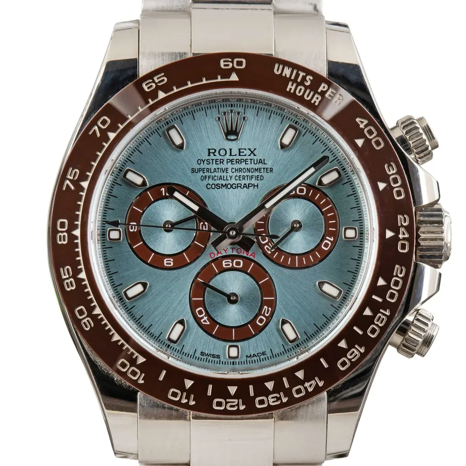 Rolex Cosmograph Daytona 116506 with an ice blue dial and brown ceramic bezel in platinum on an Oyster bracelet, a pre-owned example, studio close-up of the case