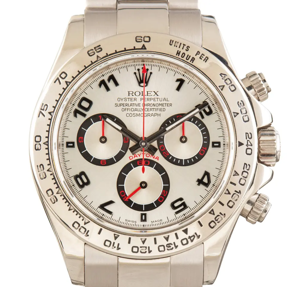 Rolex Cosmograph Daytona 116509 with a white dial with Arabic numerals and red-accented sub-dials in white gold on an Oyster bracelet, a pre-owned example, studio close-up of the case