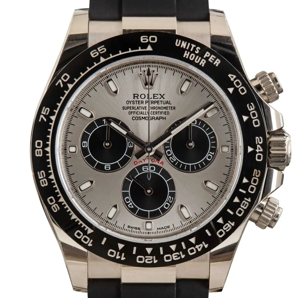 Rolex Cosmograph Daytona 116519LN with a steel-grey dial with black counters and a black ceramic tachymeter bezel in white gold on a black Oysterflex strap, a pre-owned example, studio close-up of the case
