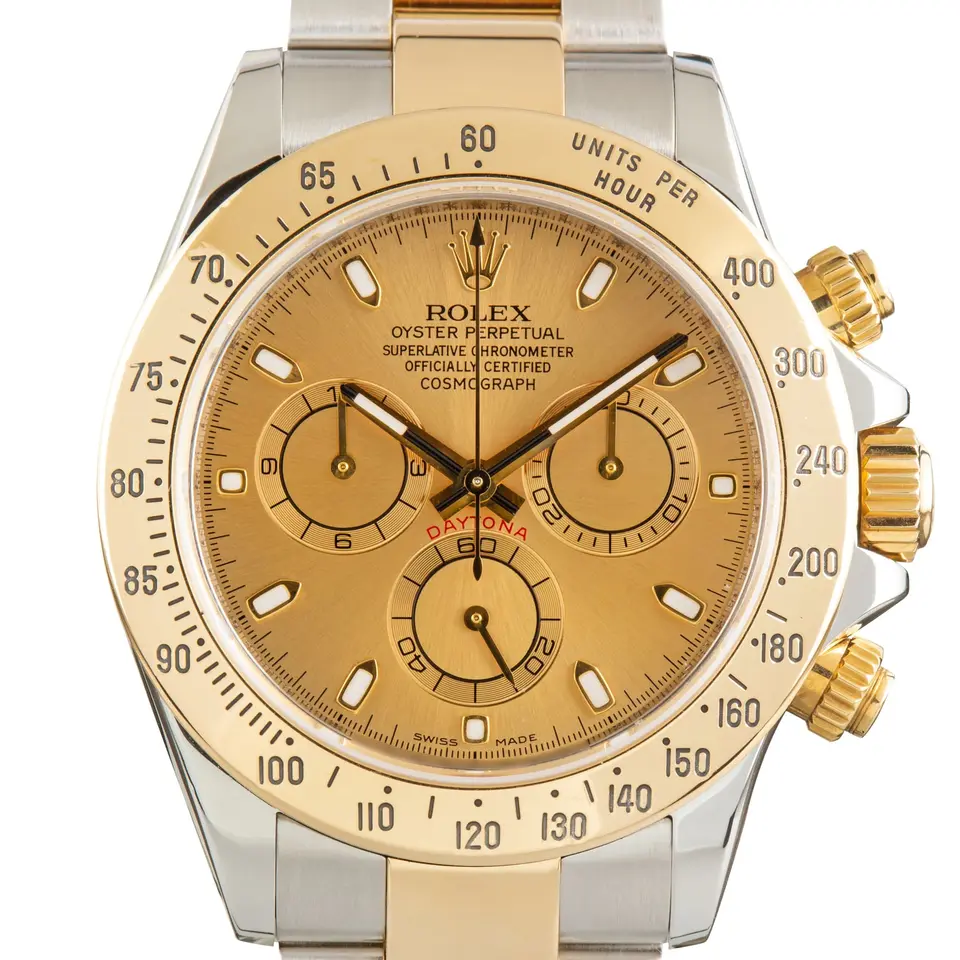 Rolex Cosmograph Daytona 116523 with a champagne dial with gold tachymeter bezel in steel and yellow gold on an Oyster bracelet, a pre-owned example, studio close-up of the case