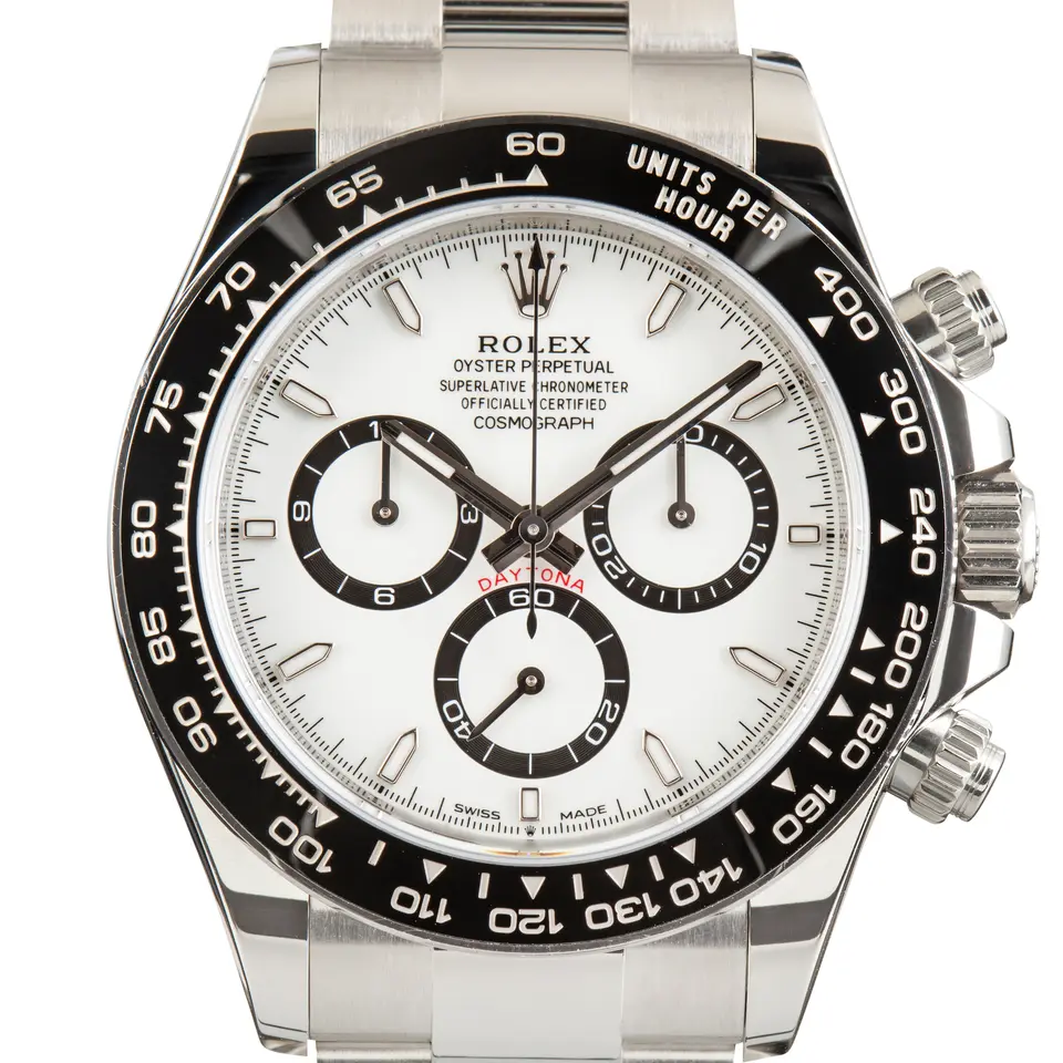 Rolex Cosmograph Daytona 126500LN with a white dial, black sub-dial rings and black ceramic tachymeter bezel, a pre-owned example, studio close-up of the case