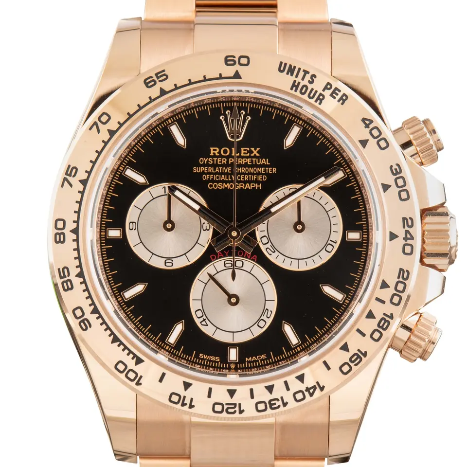 Rolex Cosmograph Daytona 126505 with a black dial with pink counters and an Everose gold tachymeter bezel, a pre-owned example, studio close-up of the case