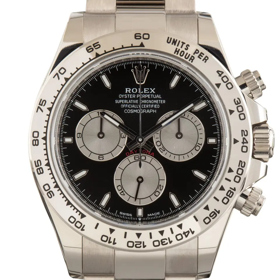 Rolex Cosmograph Daytona 126509 with a black dial with silver counters and a white gold tachymeter bezel, a pre-owned example, studio close-up of the case