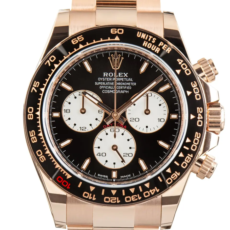 Rolex Cosmograph Daytona 126525LN with a black dial with white sub-dials and black ceramic bezel in Everose gold on an Oyster bracelet, a pre-owned example, studio close-up of the case