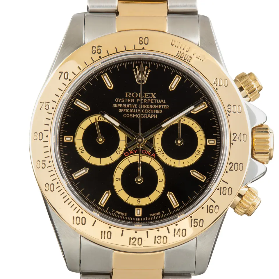 Rolex Cosmograph Daytona 16523 with a black dial with gold-ringed sub-dials in steel and yellow gold on an Oyster bracelet, a pre-owned example, studio close-up of the case