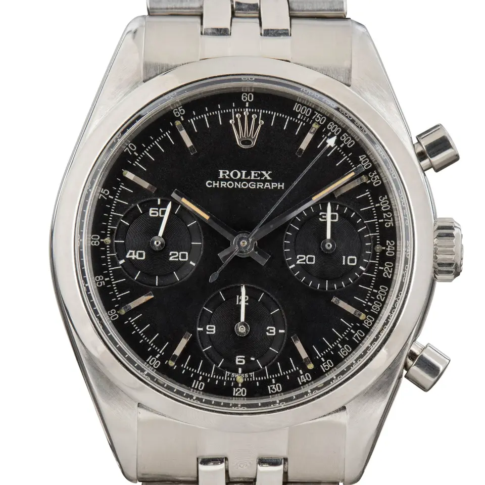 Rolex Cosmograph Daytona 6238 with a black single-colour dial with tachymeter scale, steel case, on a steel bracelet, a pre-owned example, studio close-up of the case