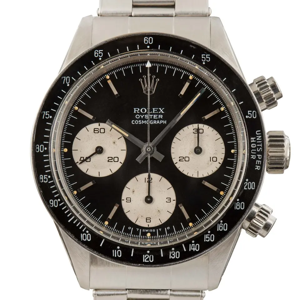 Rolex Cosmograph Daytona 6263 with a black dial with silver sub-dials and a black tachymeter bezel insert on a steel Oyster bracelet, a pre-owned example, studio close-up of the case