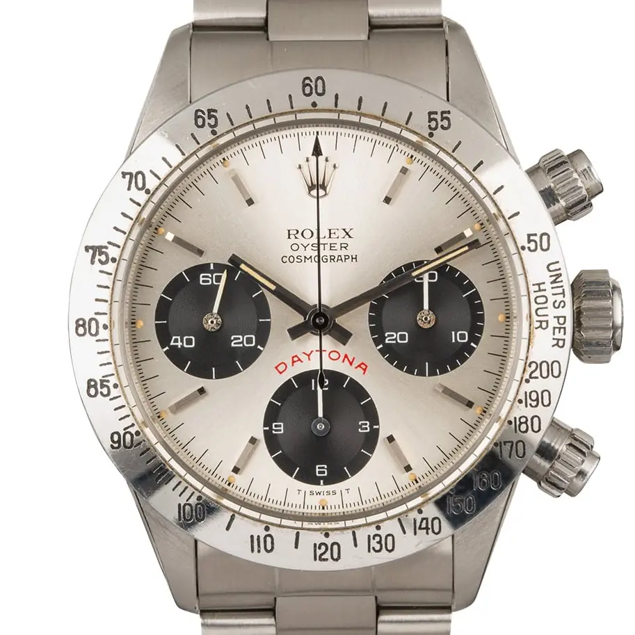 Rolex Cosmograph Daytona 6265 with a silver dial with black sub-dials and steel tachymeter bezel on an Oyster bracelet, a pre-owned example, studio close-up of the case