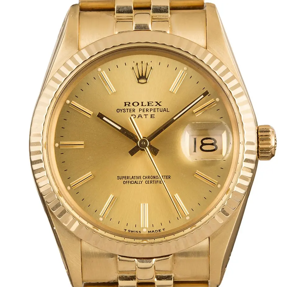 Rolex Date 15007 with a champagne dial, fluted yellow gold bezel and gold Jubilee bracelet, a pre-owned example, studio close-up of the case