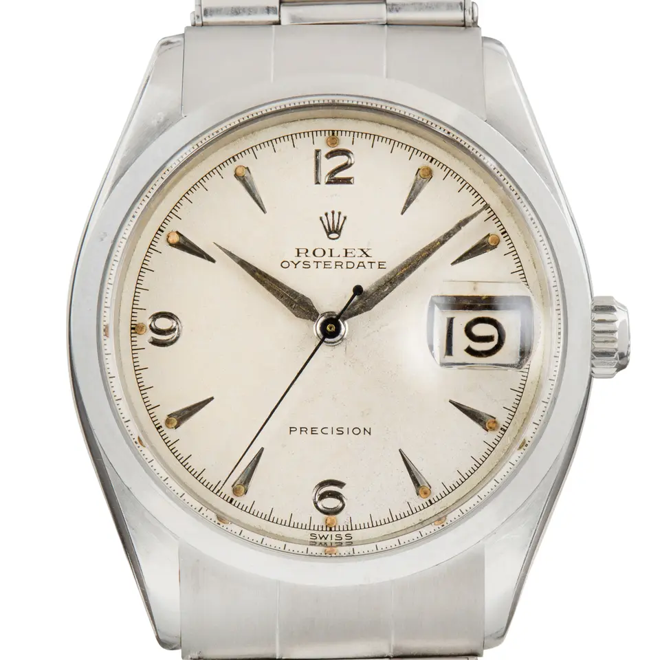 Rolex Oyster Date 6294 with a white OysterDate Precision dial with 3, 6, 9 and 12 numerals, smooth steel bezel and steel Oyster bracelet, a pre-owned example, studio close-up of the case