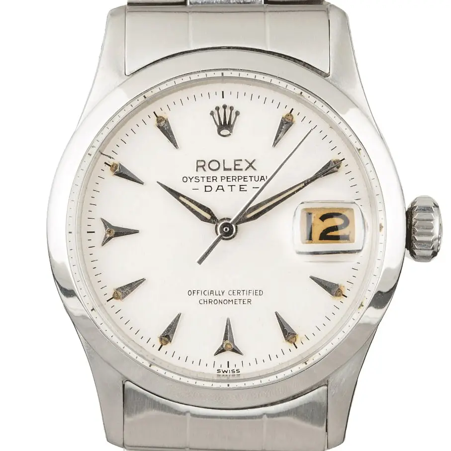 Rolex Date 6518 with a white dial with arrow markers, smooth steel bezel and steel Oyster bracelet, a pre-owned example, studio close-up of the case