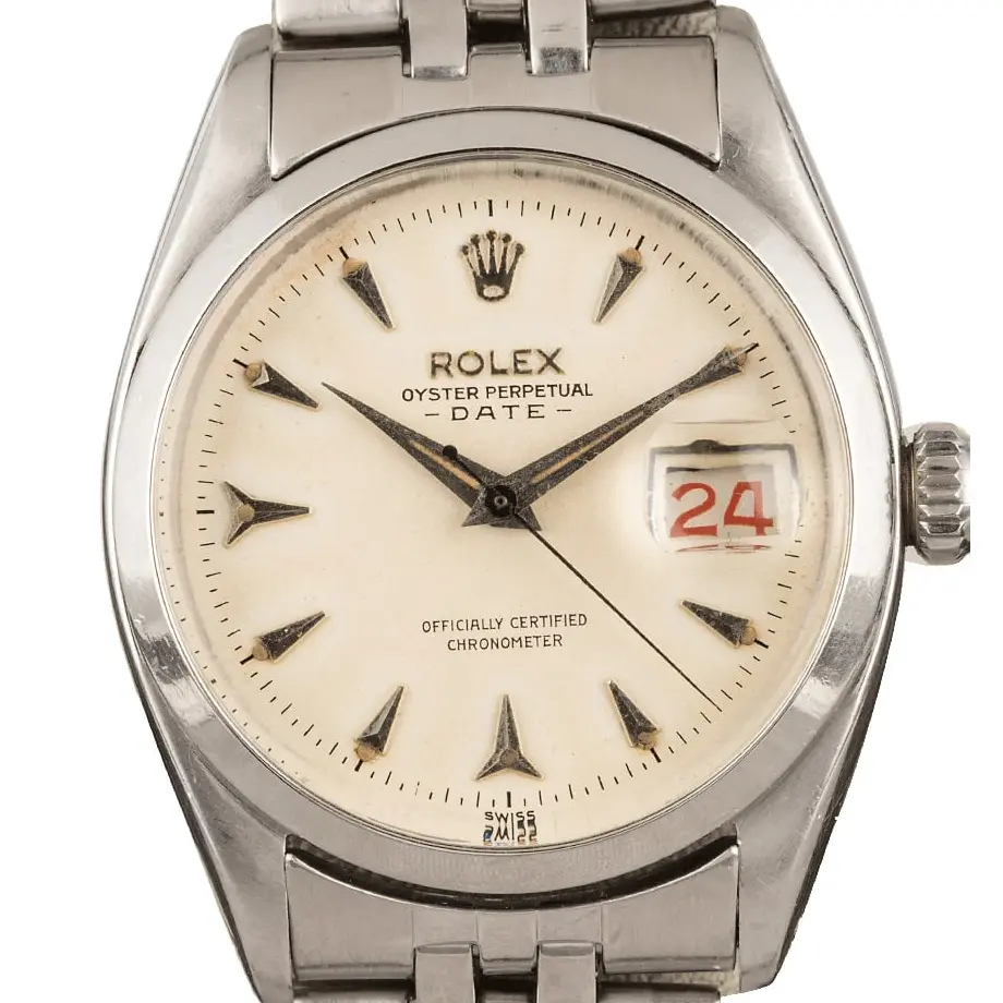 Rolex Oyster Perpetual Date 6534 with a cream dial with arrow markers, smooth steel bezel and steel Jubilee bracelet, a pre-owned example, studio close-up of the case