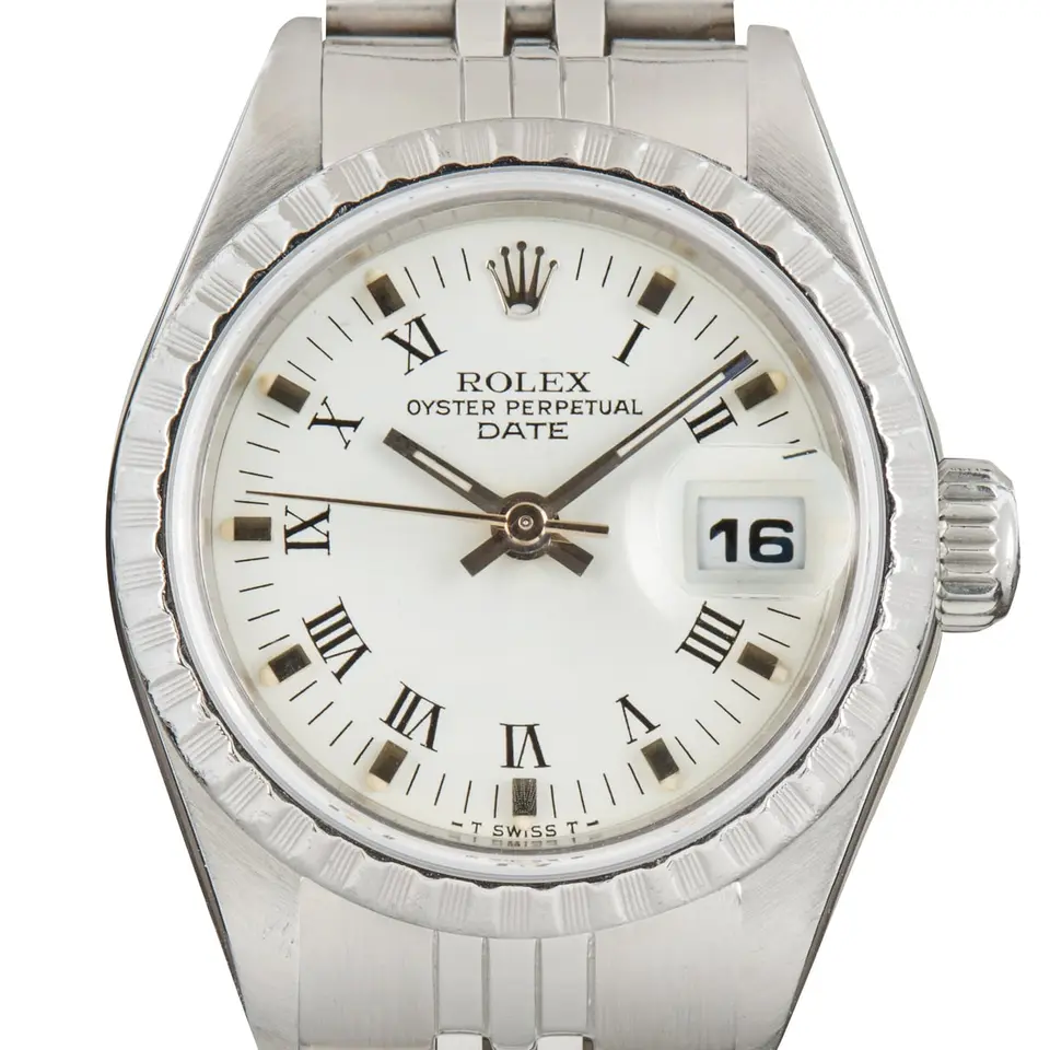 Rolex Oyster Perpetual Lady Date 26 69240 with a white Roman-numeral dial, engine-turned steel bezel and steel Jubilee bracelet, a pre-owned example, studio close-up of the case