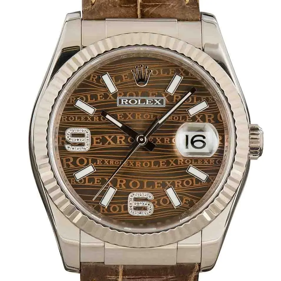 Rolex Datejust 36 116139 with a brown patterned dial and fluted white gold bezel on a brown leather strap, a pre-owned example, studio close-up of the case