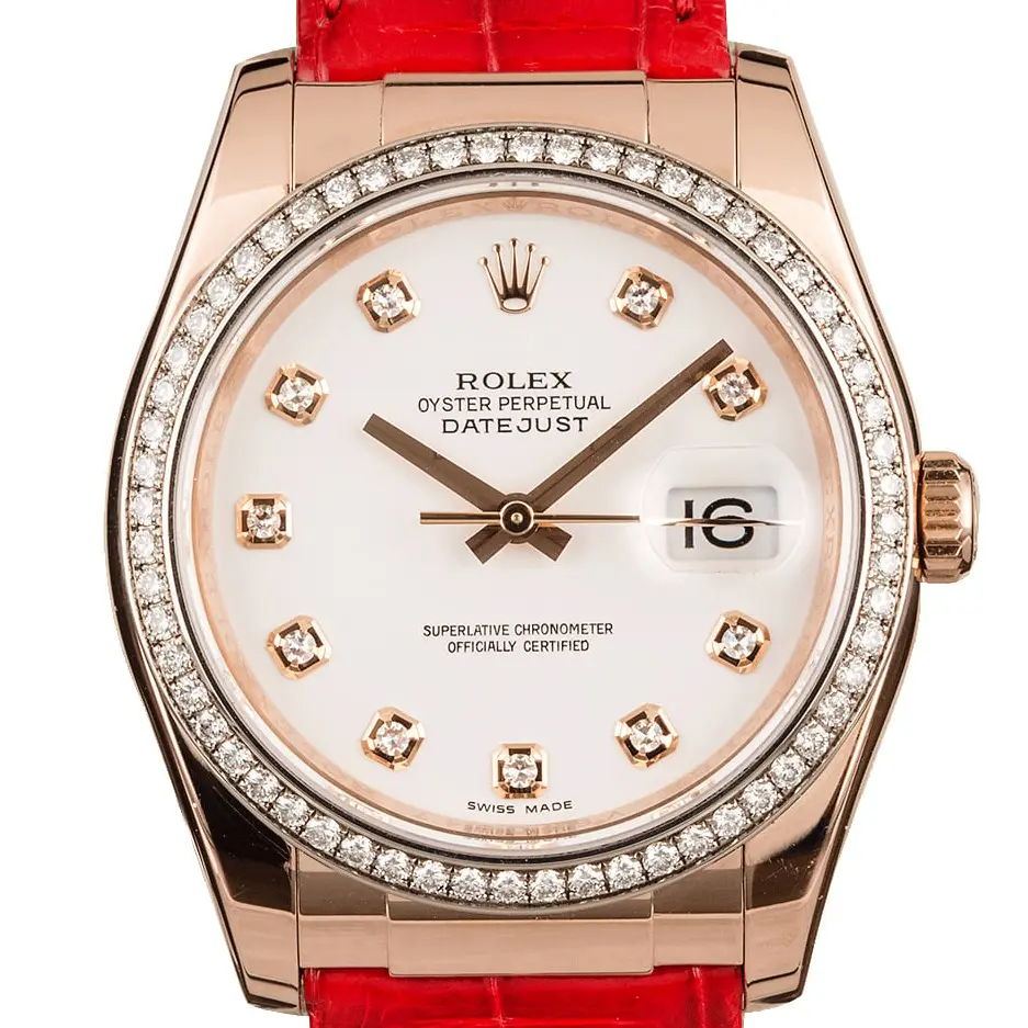 Rolex Datejust 36 116185 with a white dial with diamond hour markers, diamond-set bezel and Everose gold case on a red leather strap, a pre-owned example, studio close-up of the case