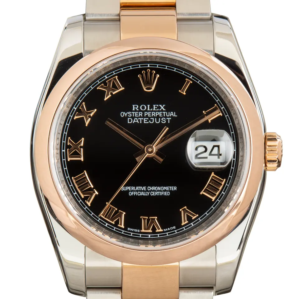 Rolex Datejust 36 116201 with a black dial with Roman numerals and smooth Everose bezel in steel and Everose gold on an Oyster bracelet, a pre-owned example, studio close-up of the case