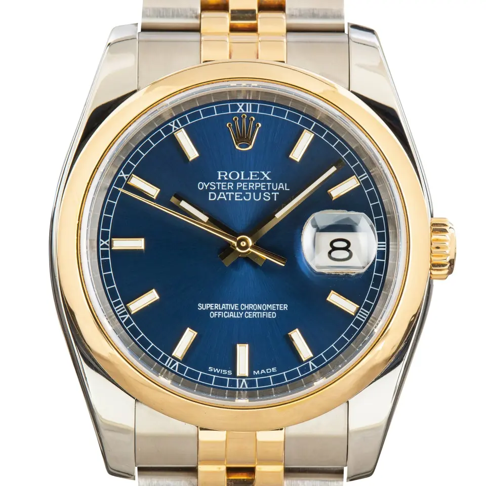 Rolex Datejust 36 116203 with a blue dial and smooth yellow gold bezel in steel and yellow gold on a Jubilee bracelet, a pre-owned example, studio close-up of the case