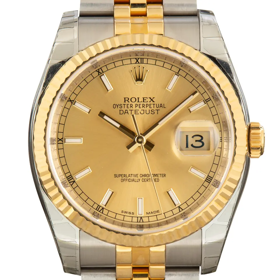 Rolex Datejust 36 116233 with a champagne dial and fluted yellow gold bezel in steel and yellow gold on a Jubilee bracelet, a pre-owned example, studio close-up of the case