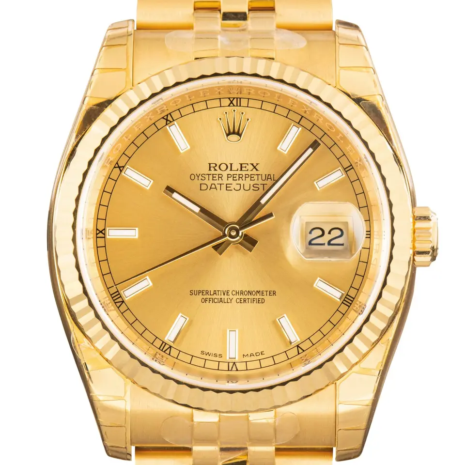 Rolex Datejust 36 116238 with a champagne dial, fluted yellow gold bezel and yellow gold Jubilee bracelet, a pre-owned example, studio close-up of the case