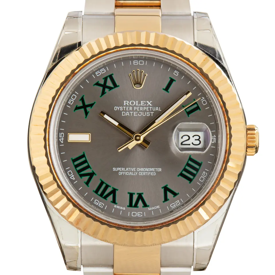 Rolex Datejust II 116333 with a slate dial with green Roman numerals and fluted yellow gold bezel in steel and yellow gold on an Oyster bracelet, a pre-owned example, studio close-up of the case