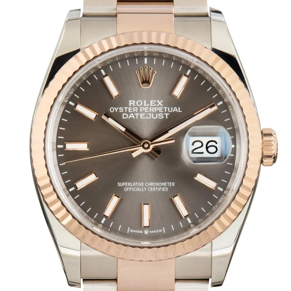 Rolex Datejust 36 126231 with a slate dial and a fluted Everose gold bezel, a pre-owned example, studio close-up of the case
