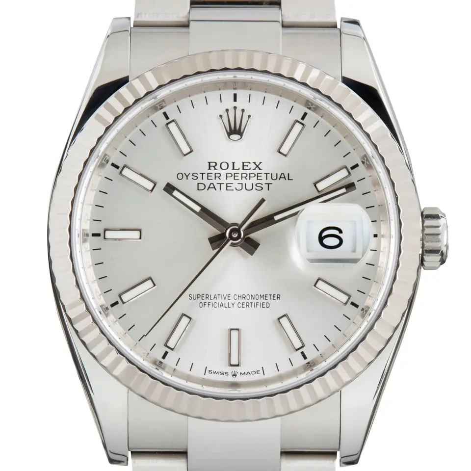 Rolex Datejust 36 126234 with a silver dial and a fluted white gold bezel, a pre-owned example, studio close-up of the case
