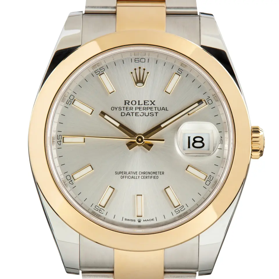 Rolex Datejust 41 126303 with a silver dial and a smooth yellow gold bezel, a pre-owned example, studio close-up of the case
