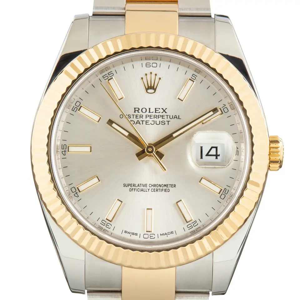 Rolex Datejust 41 126333 with a silver dial and a fluted yellow gold bezel, a pre-owned example, studio close-up of the case
