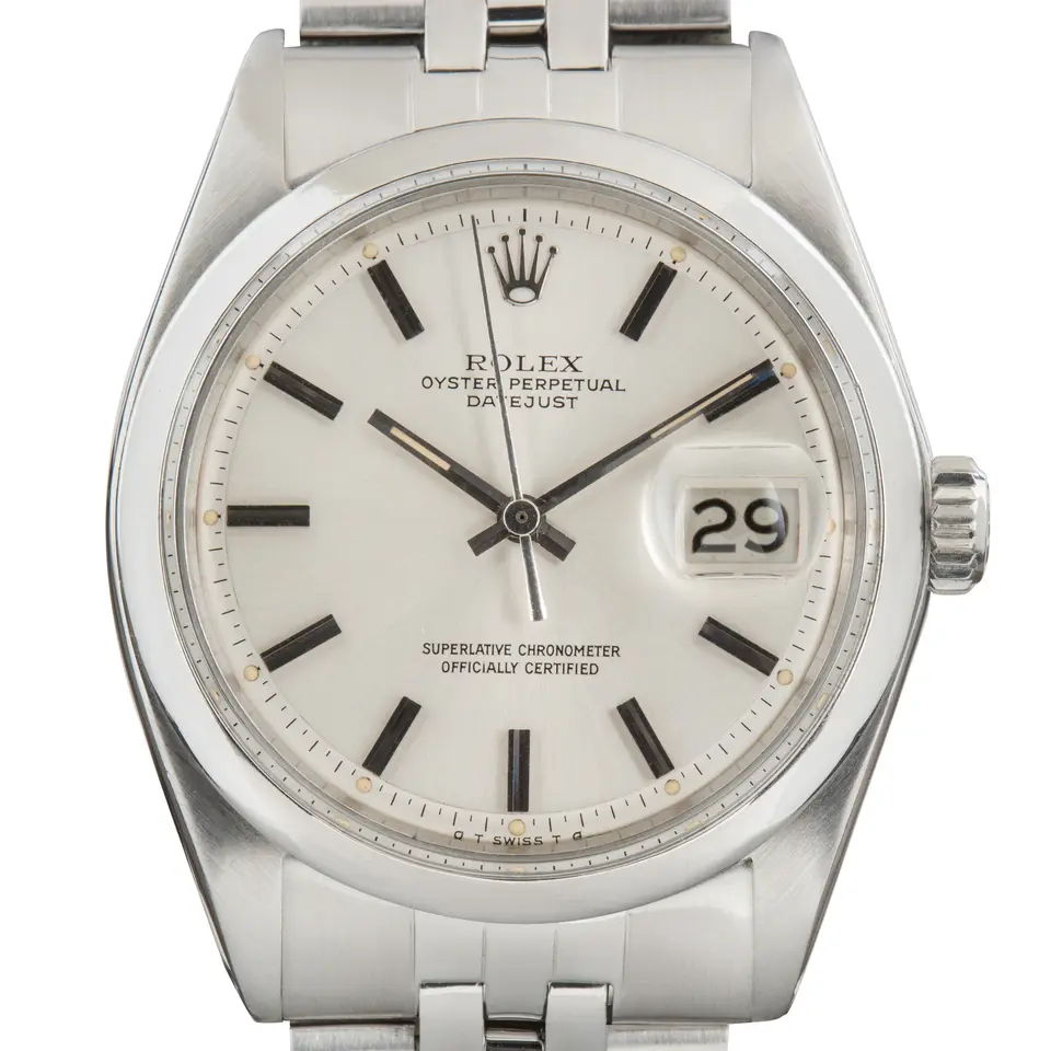 Rolex Datejust 1600 with a silver pie-pan dial and smooth steel bezel on a Jubilee bracelet, a pre-owned example, studio close-up of the case