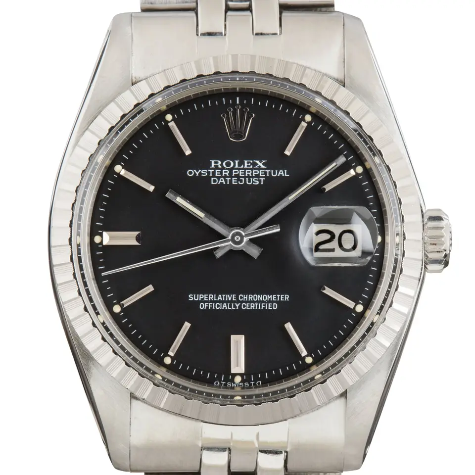 Rolex Datejust 1603 with a black dial and engine-turned steel bezel on a Jubilee bracelet, a pre-owned example, studio close-up of the case
