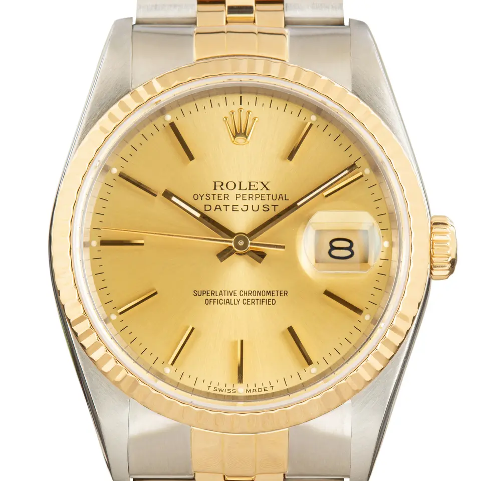 Rolex Datejust 16233 with a champagne dial and fluted yellow gold bezel in steel and yellow gold on a Jubilee bracelet, a pre-owned example, studio close-up of the case