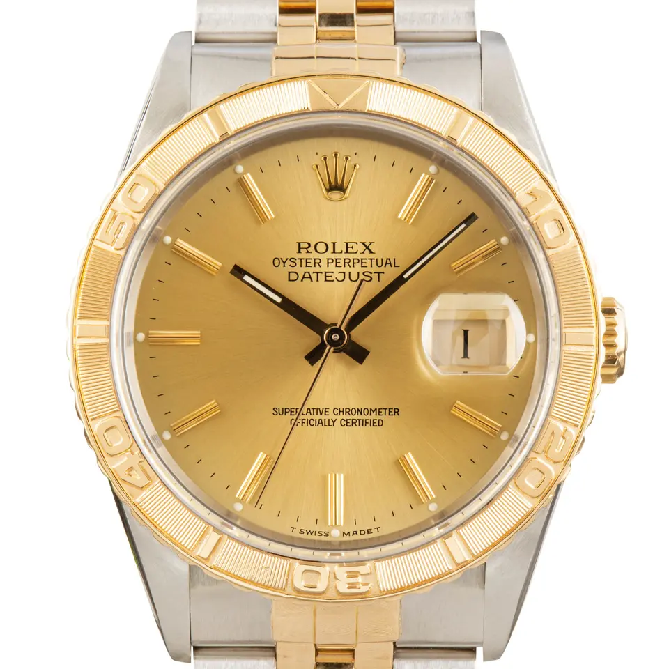 Rolex Datejust Turn-O-Graph 16263 with a champagne dial and rotating yellow gold bezel in steel and yellow gold on a Jubilee bracelet, a pre-owned example, studio close-up of the case