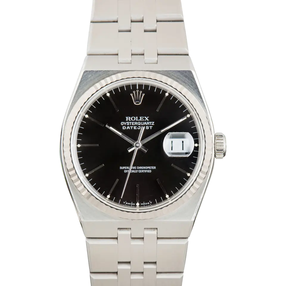 Rolex Oysterquartz Datejust 17014 with a black Oysterquartz dial, fluted white gold bezel and integrated steel bracelet, a pre-owned example, front view of the whole watch