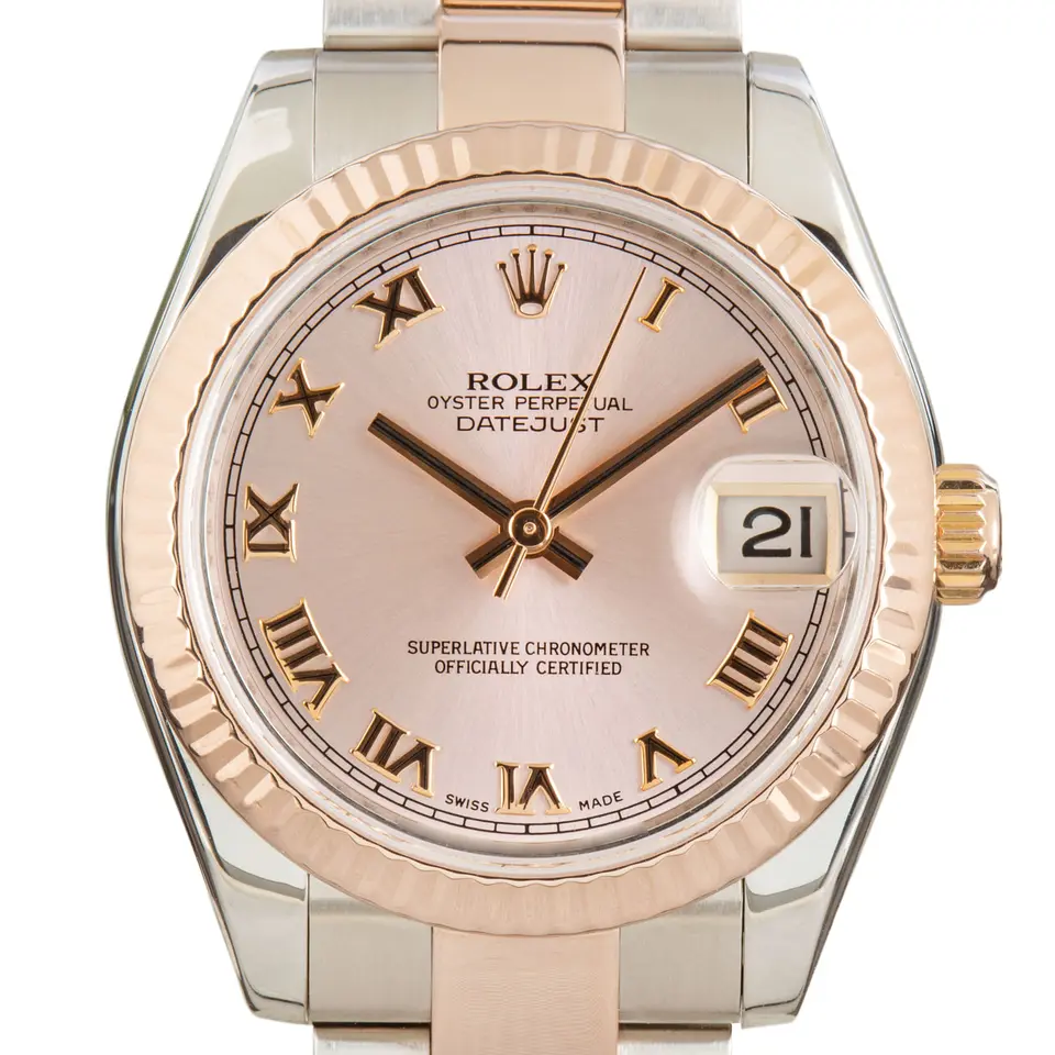 Rolex Datejust 31 178271 with a pink dial with Roman numerals and fluted Everose bezel in steel and Everose gold on an Oyster bracelet, a pre-owned example, studio close-up of the case