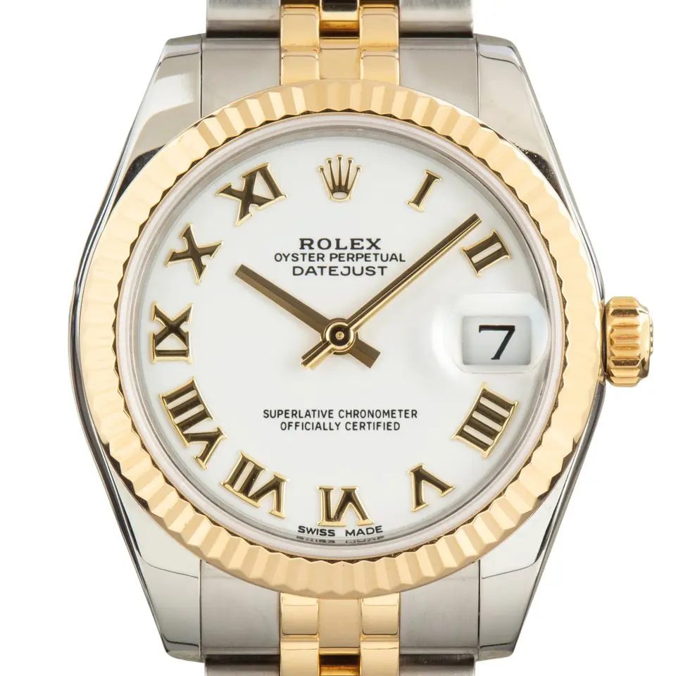 Rolex Datejust 31 178273 with a white dial with Roman numerals and fluted yellow gold bezel in steel and yellow gold on a Jubilee bracelet, a pre-owned example, studio close-up of the case