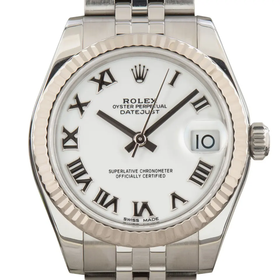 Rolex Datejust 31 178274 with a white dial with Roman numerals and fluted white gold bezel on a steel Jubilee bracelet, a pre-owned example, studio close-up of the case
