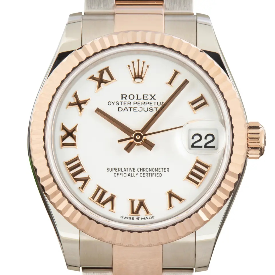 Rolex Datejust 31 278271 with a white dial with Roman numerals and a fluted Everose gold bezel, a pre-owned example, studio close-up of the case