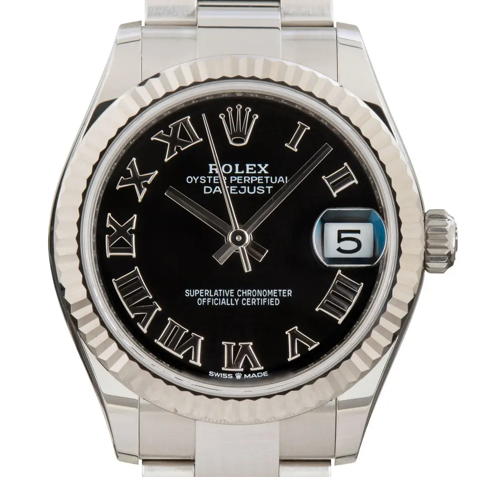 Rolex Datejust 31 278274 with a black dial with Roman numerals and a fluted white gold bezel, a pre-owned example, studio close-up of the case