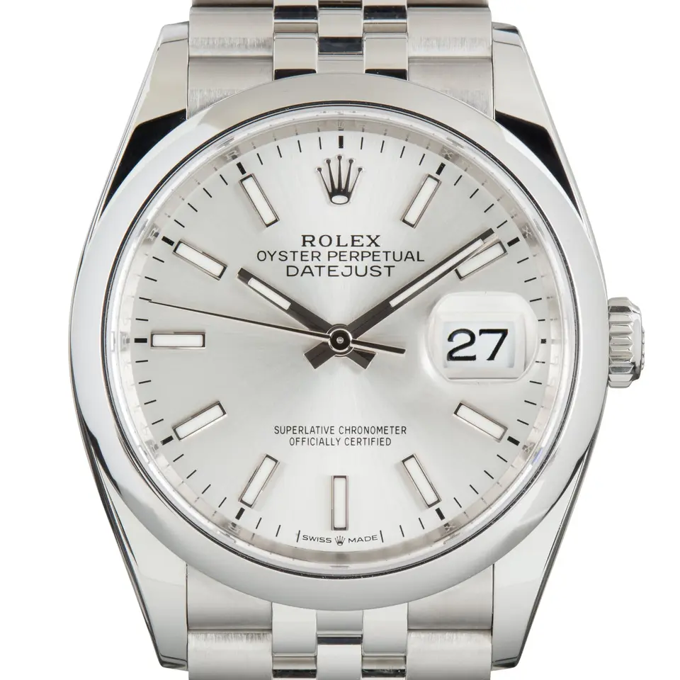 Rolex Datejust 36 126200 with a silver dial and a smooth domed steel bezel, a pre-owned example, studio close-up of the case