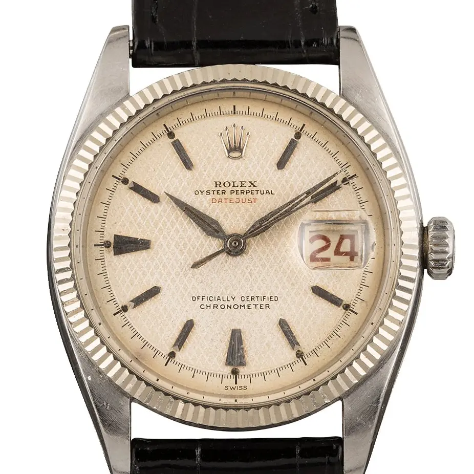 Rolex Datejust 36 6305 with a silver honeycomb dial, fluted bezel and steel case on a black leather strap, a pre-owned example, studio close-up of the case